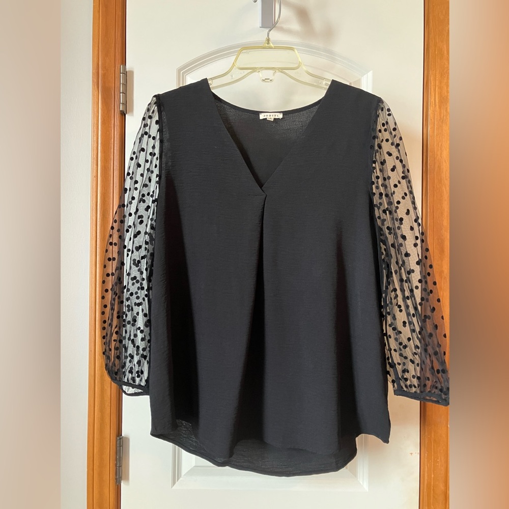 Black top with polka a dot sleeves